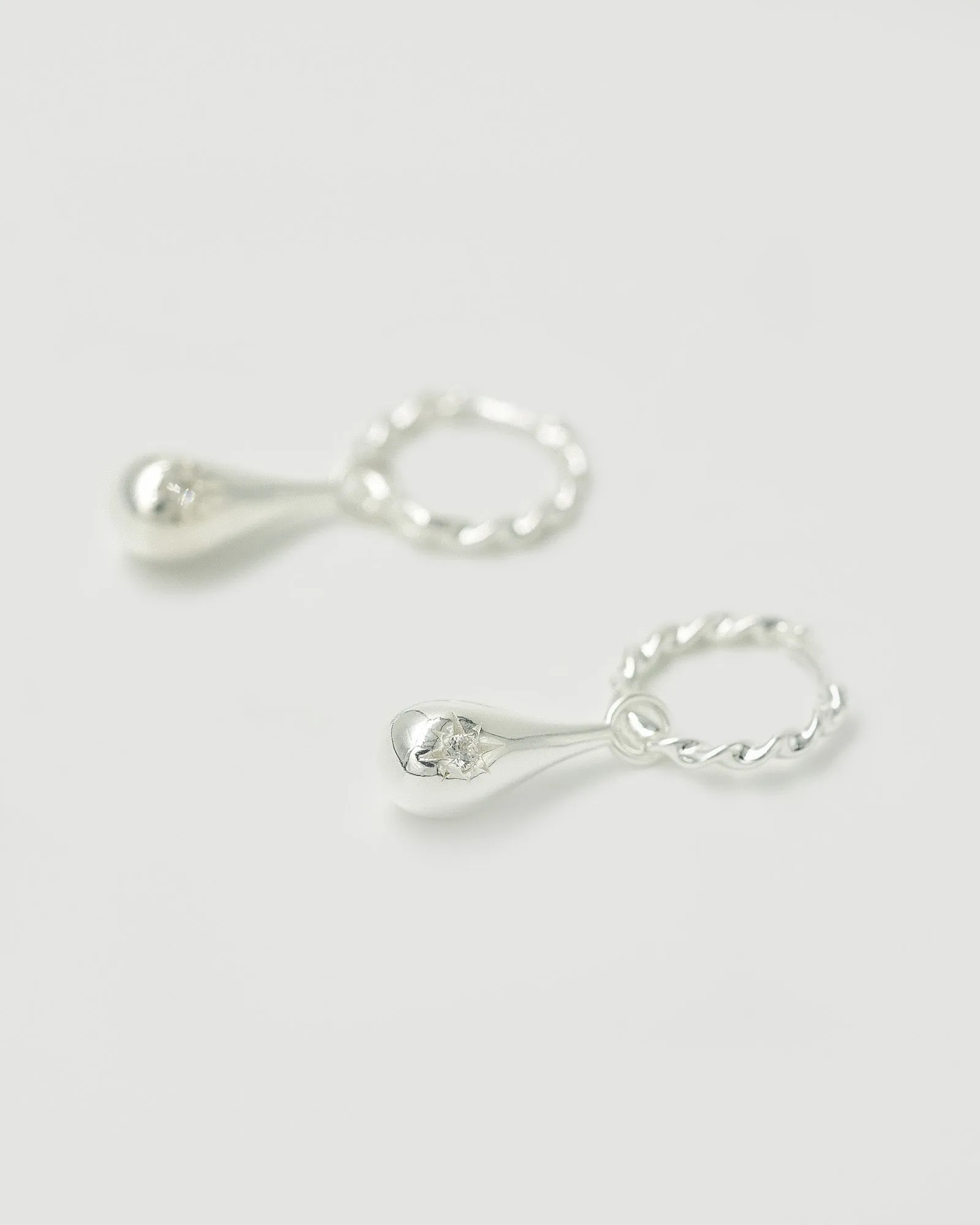 Tear Drop Twist Sleeper Earrings Clear